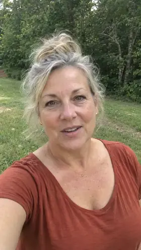 An older actor on a morning walk at the edge of a mown field talks to the camera, an ad for a bird identification app.