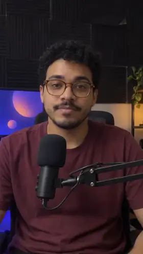 An actor sits behind a podcast microphone in a small recording room and talks to the camera, an ad for a podcast editing app.